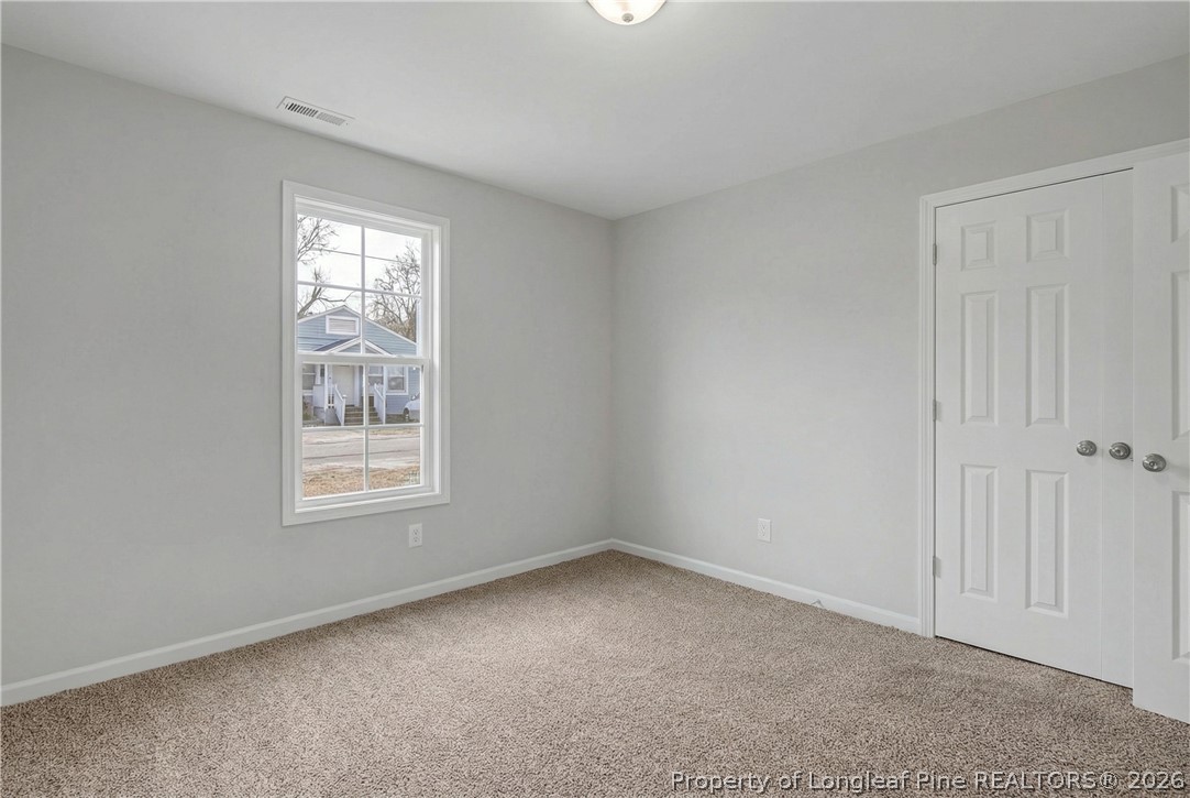 214 Lee Street Spring Lake, NC 28390 - Photo 39 of 44 an empty room with windows