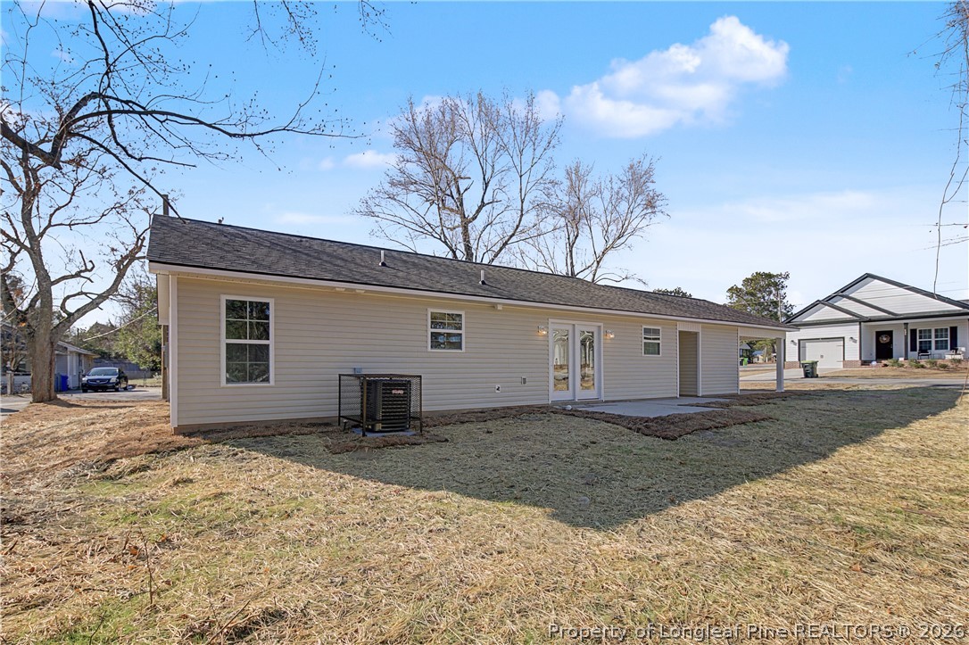 214 Lee Street Spring Lake, NC 28390 - Photo 44 of 44 a view of a house with a yard covered in snow
