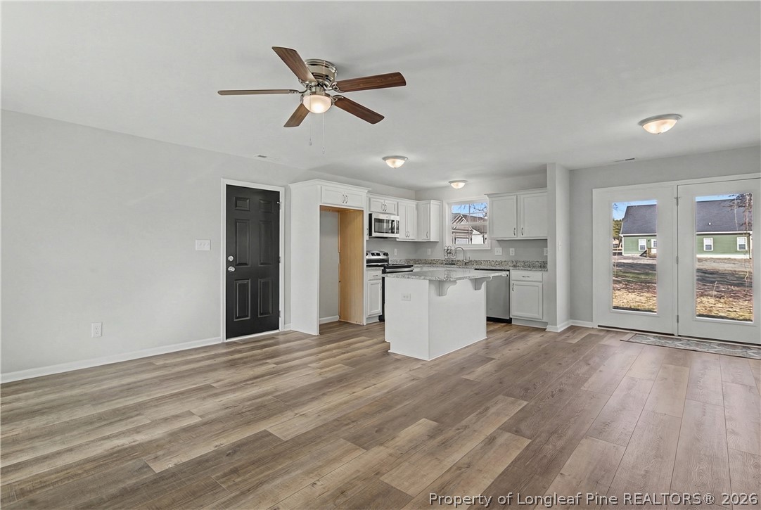 214 Lee Street Spring Lake, NC 28390 - Photo 6 of 44 a view of a kitchen with wooden floor
