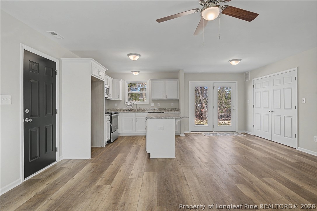 214 Lee Street Spring Lake, NC 28390 - Photo 7 of 44 a view of kitchen with wooden floor