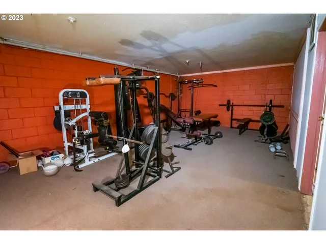 a living room with furniture and a dining table