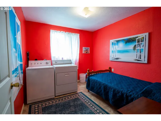 a kitchen with sink cabinets and a large window