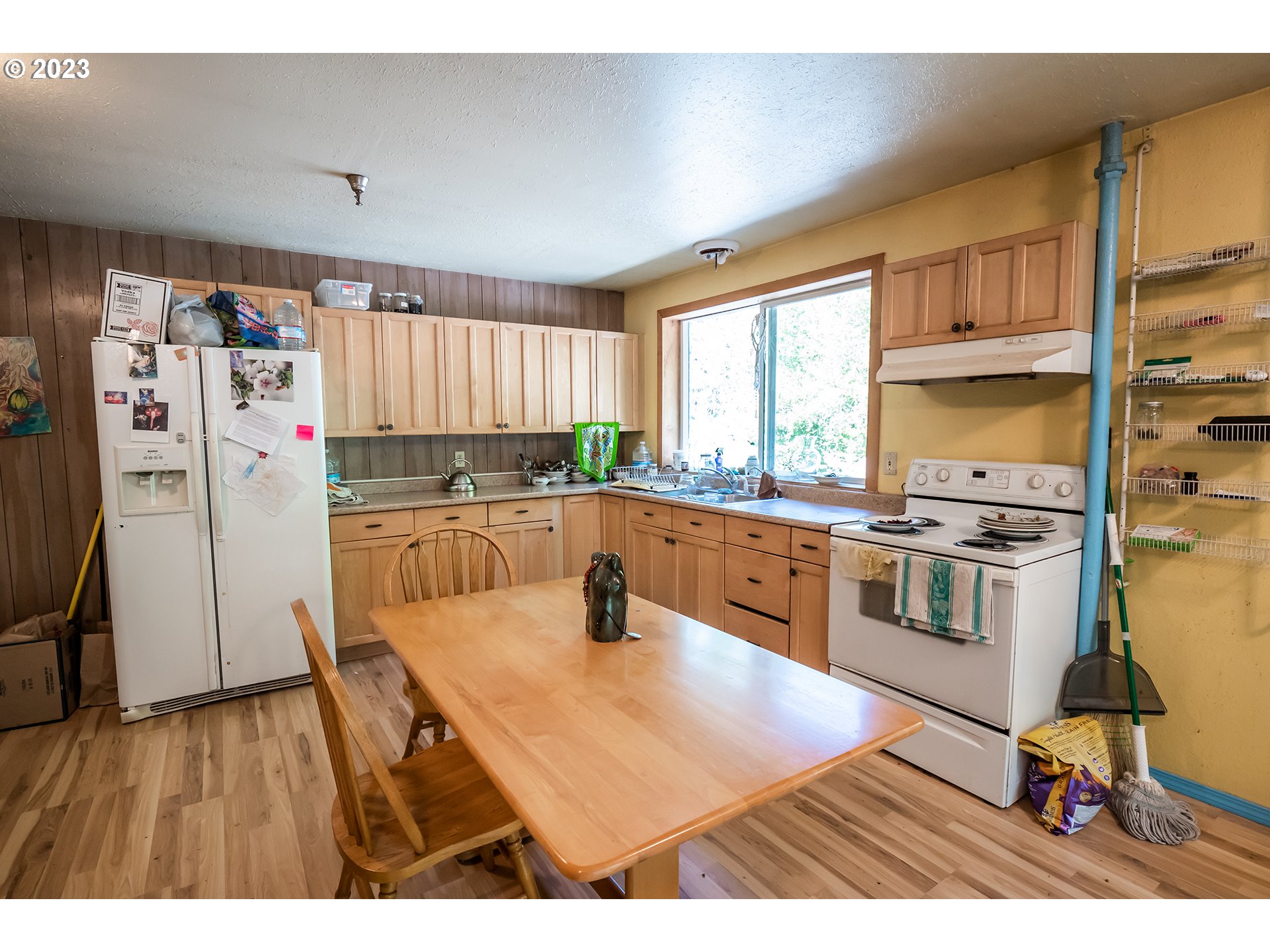 18624 Highway 36 Blachly, OR 97412 - Photo 38 of 46 a kitchen with stainless steel appliances a stove a sink a refrigerator and cabinets