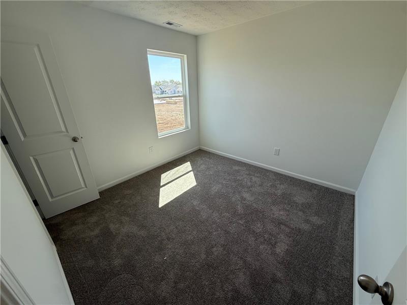 4005 Chakeres Avenue Springfield, OH 45505 - Photo 17 of 19 This cozy bedroom offers a tranquil retreat with soft carpet and natural light.