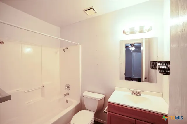 a bathroom with a sink toilet a shower and a mirror