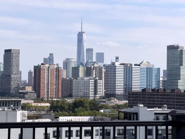 a view of a city with tall buildings