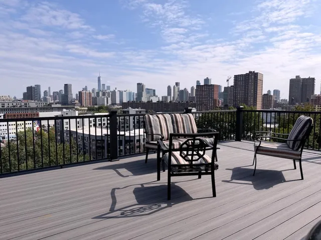 a view of a terrace with wooden benches