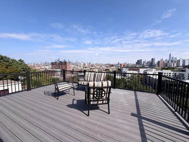 a view of a terrace with wooden benches