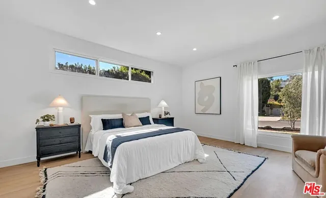 a kitchen with granite countertop a stove and a refrigerator