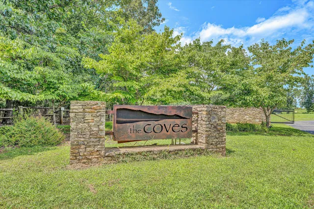 a sign that is sitting in the grass