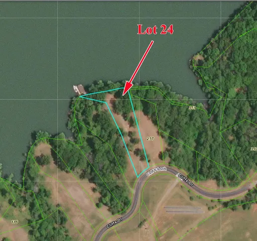 a street sign that is sitting on a wooden wall