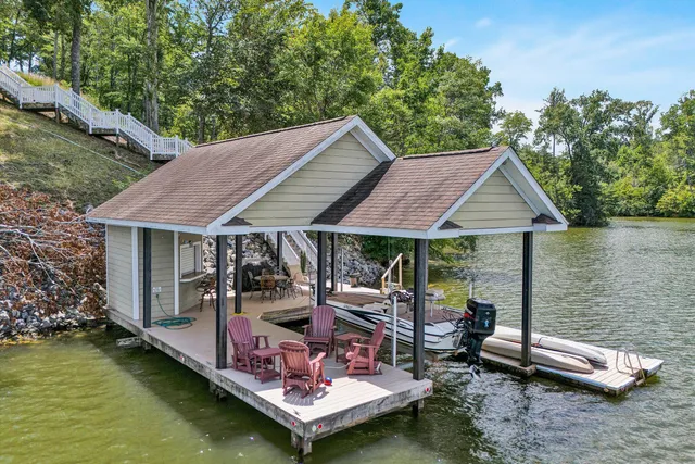 a backyard of a house with yard barbeque oven and outdoor seating