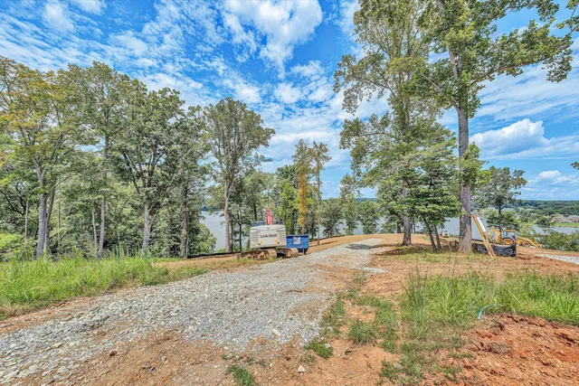 a view of road with a houses