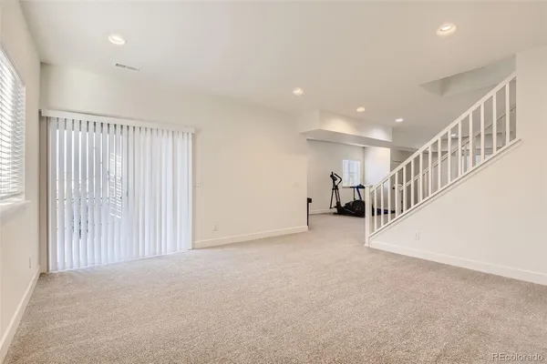 a view of an empty room with stairs