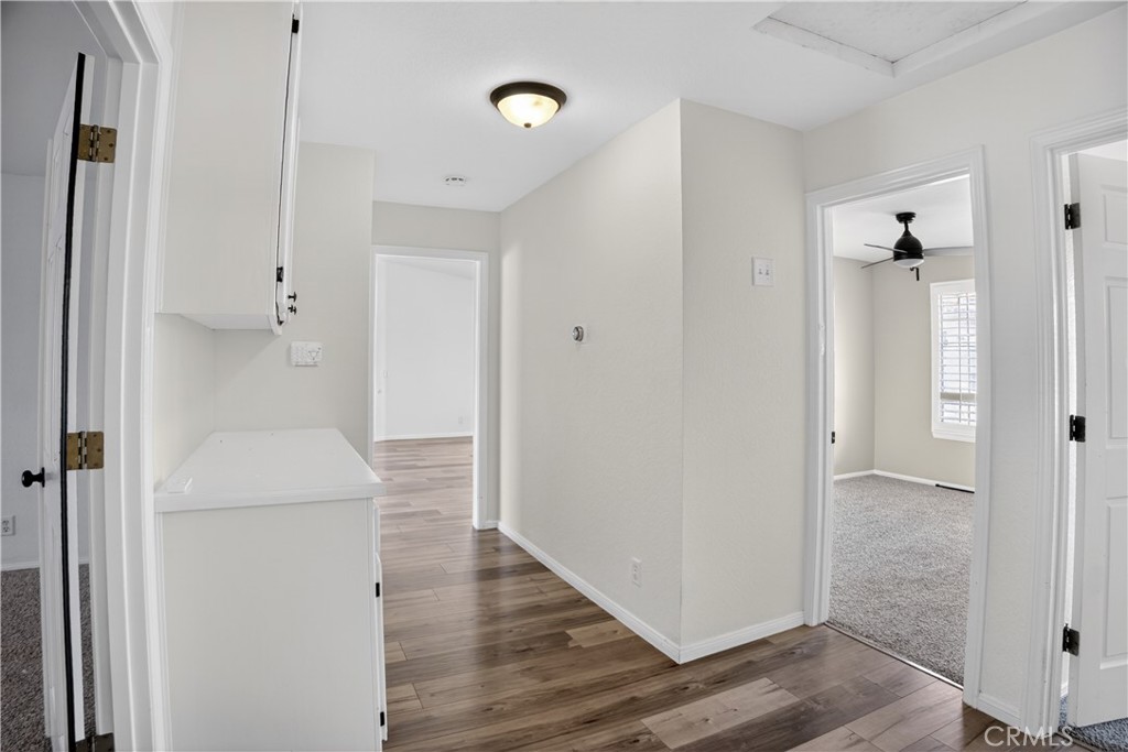 43631 37th Street West Lancaster, CA 93536 - Photo 18 of 38 a view of a hallway with wooden floor