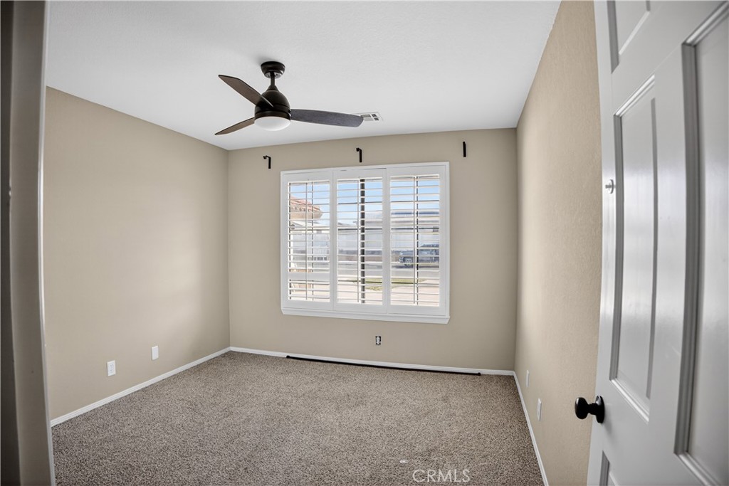 43631 37th Street West Lancaster, CA 93536 - Photo 20 of 38 a view of an empty room with a window