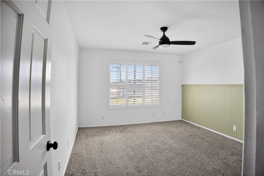 43631 37th Street West Lancaster, CA 93536 - Photo 21 of 38 a view of an empty room with a window