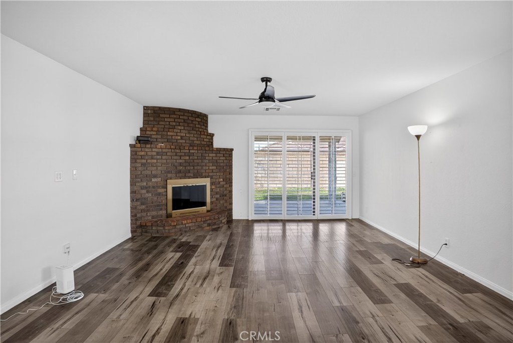43631 37th Street West Lancaster, CA 93536 - Photo 7 of 38 wooden floor in an empty room with a window