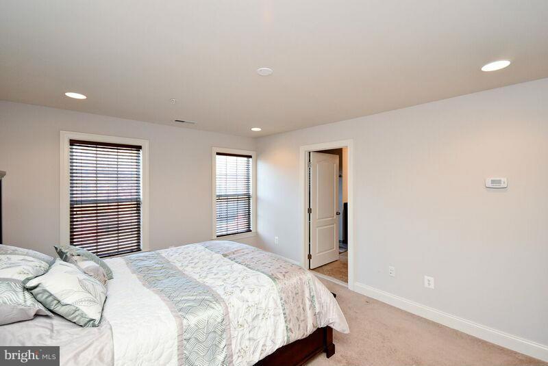 7616 Elmcrest Road Hanover, MD 21076 - Photo 16 of 30 a bedroom with a bed and a window
