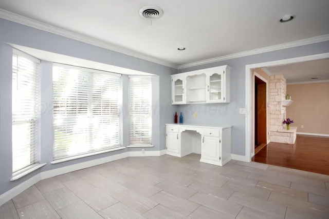 a view of a room with window and hardwood floor