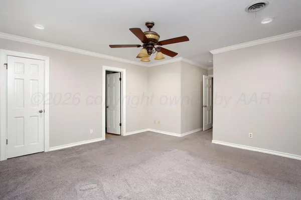 a view of a livingroom with a ceiling fan and window