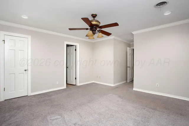 a view of a livingroom with a ceiling fan and window