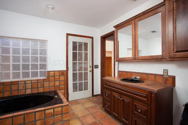 a kitchen that has a sink and a stove