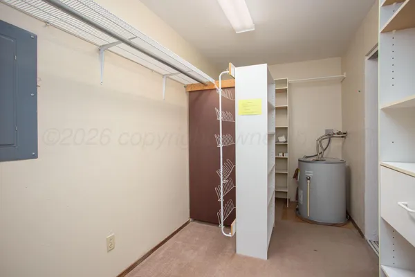 a bathroom with a shower and a room