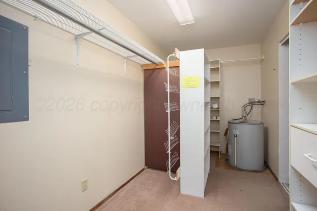 a bathroom with a shower and a room