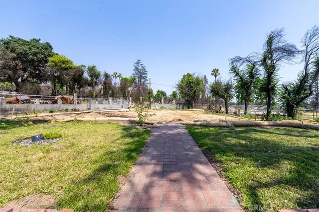 a view of a yard with swimming pool
