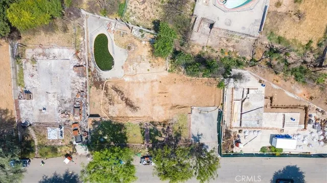 an aerial view of a house with a swimming pool