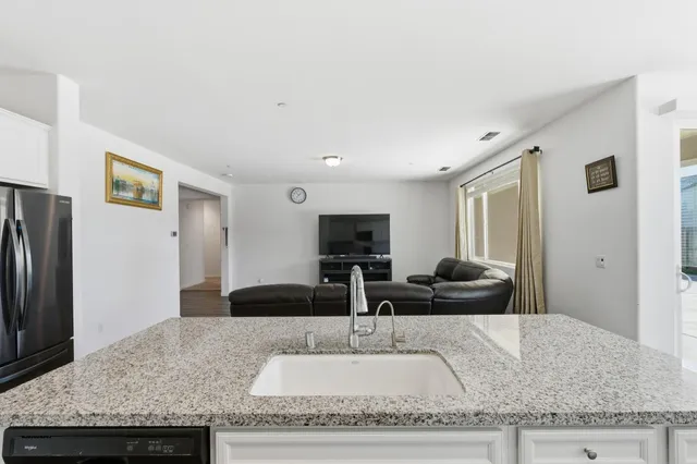 a view of a dining room with furniture large windows and wooden floor