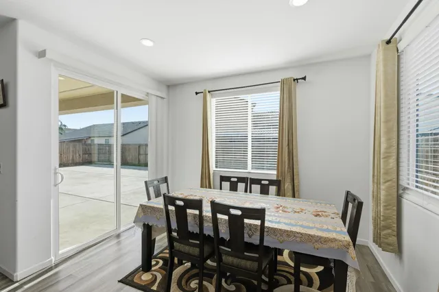 a kitchen with stainless steel appliances a refrigerator and a stove