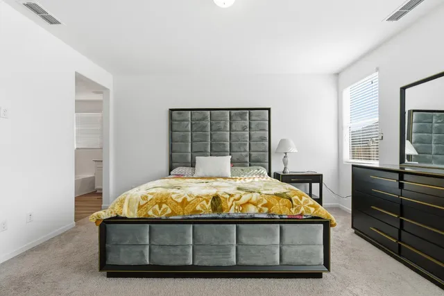 a bathroom with a shower a sink and a mirror