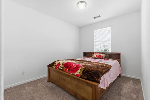 a bathroom with a granite countertop sink a mirror a bathtub and shower