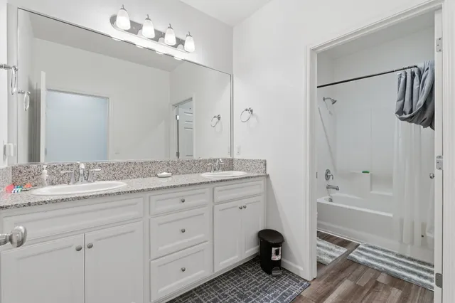 a white bath tub sitting next to a toilet