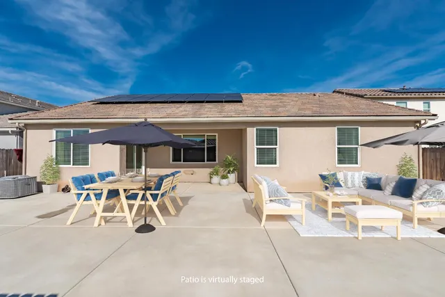 a front view of a house with a outdoor space