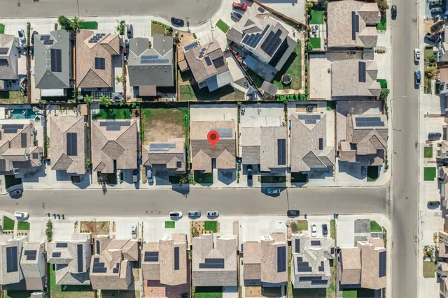 an aerial view of a building with an outdoor space