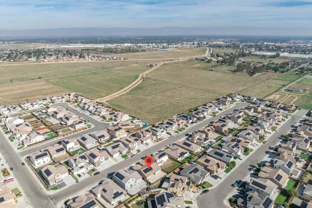 an aerial view of a house with a ocean view