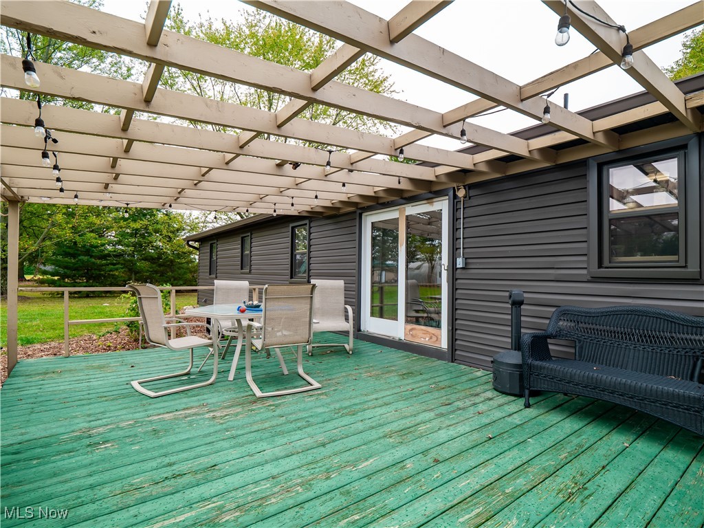 9049 Oberlin Road Elyria, OH 44035 - Photo 25 of 42 Wooden deck with outdoor dining area