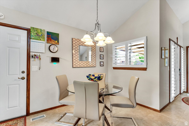 2863 Fallentine Road Sandy, UT 84093 - Photo 15 of 48 Dining area featuring sloped ceilings, tile flooring, and a window with plantation shutters