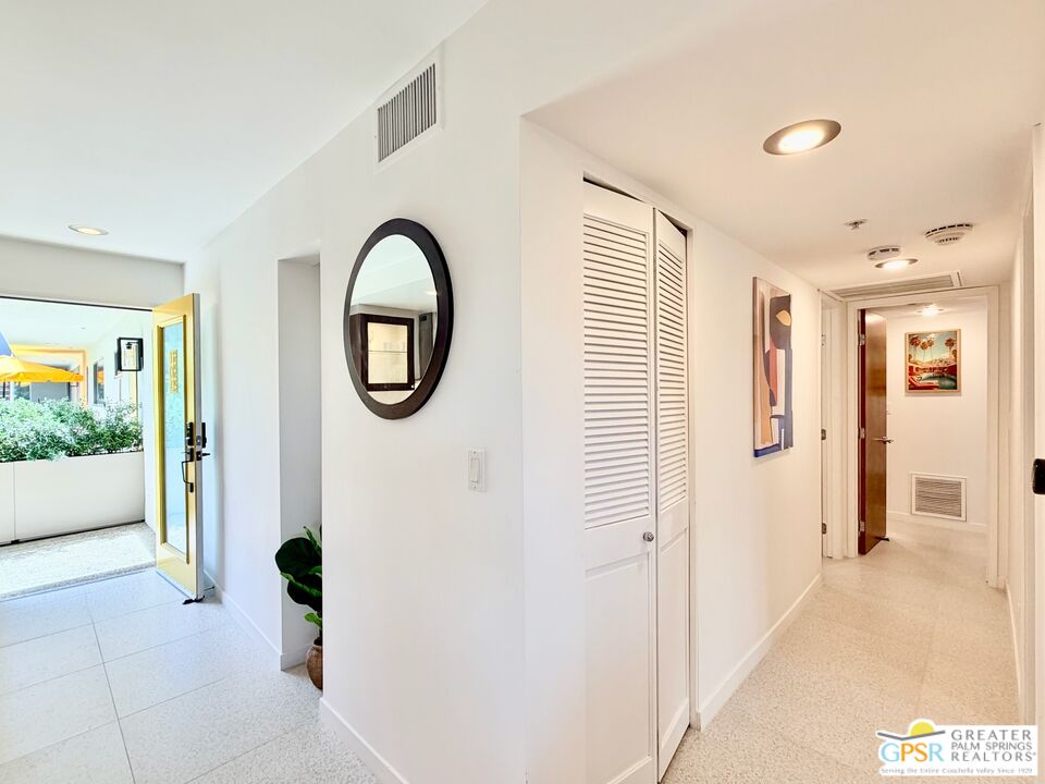 588 East San Lorenzo Road, Unit 104 Palm Springs, CA 92264 - Photo 19 of 74 a front view of a house with garden