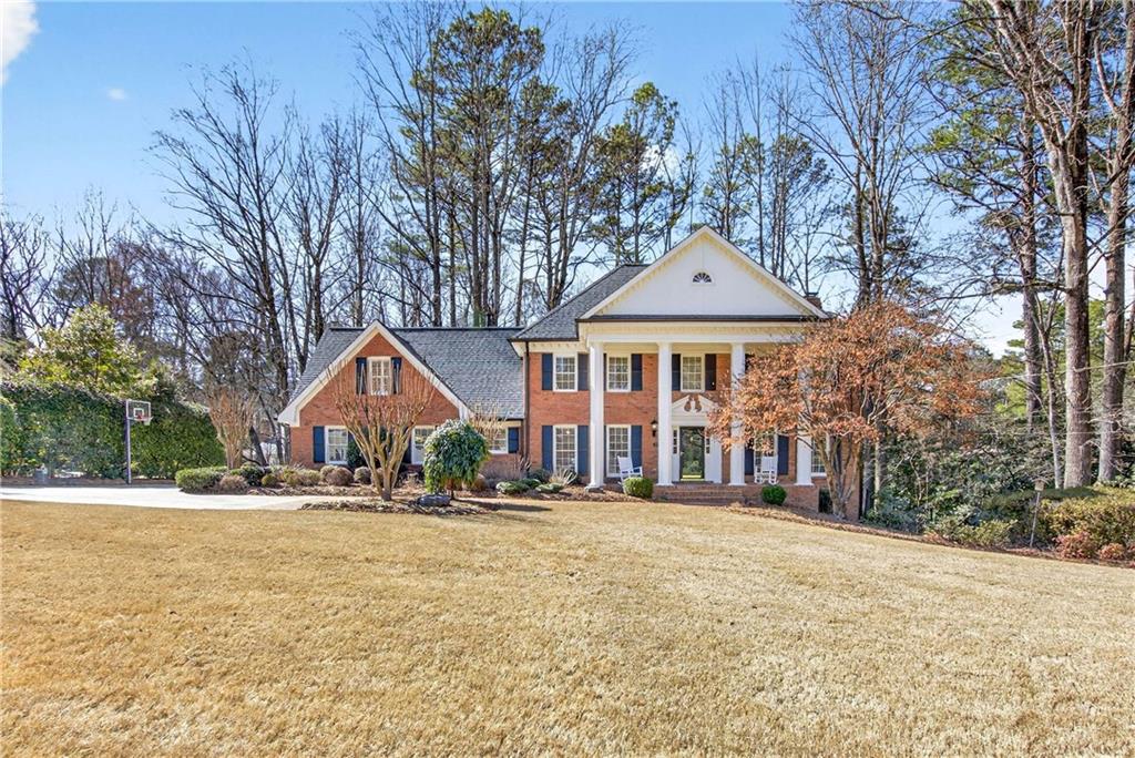 350 Spindle Court Sandy Springs, GA 30350 - Photo 1 of 1 a front view of a house with a yard