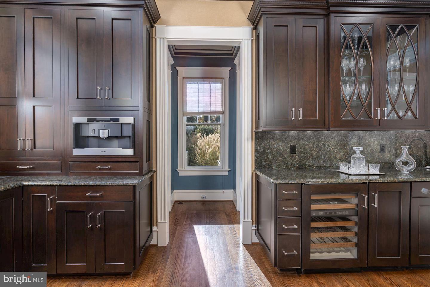 833 Herbert Springs Road Alexandria, VA 22308 - Photo 13 of 34 a kitchen with granite countertop a cabinets and wooden floor