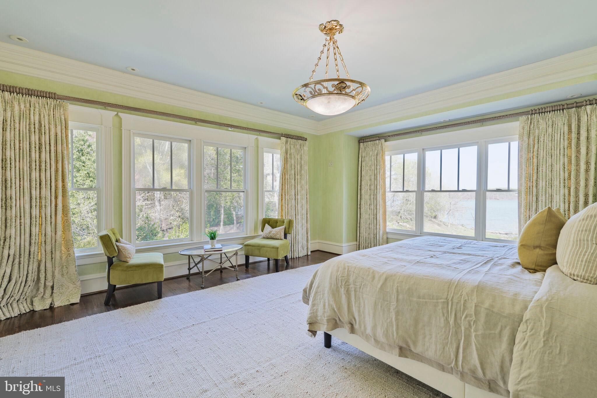 833 Herbert Springs Road Alexandria, VA 22308 - Photo 18 of 34 a bedroom with a bed and a large window