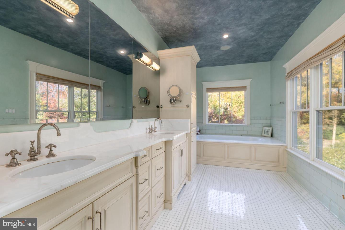 833 Herbert Springs Road Alexandria, VA 22308 - Photo 20 of 34 a spacious bathroom with a granite countertop sink mirror and a bathtub