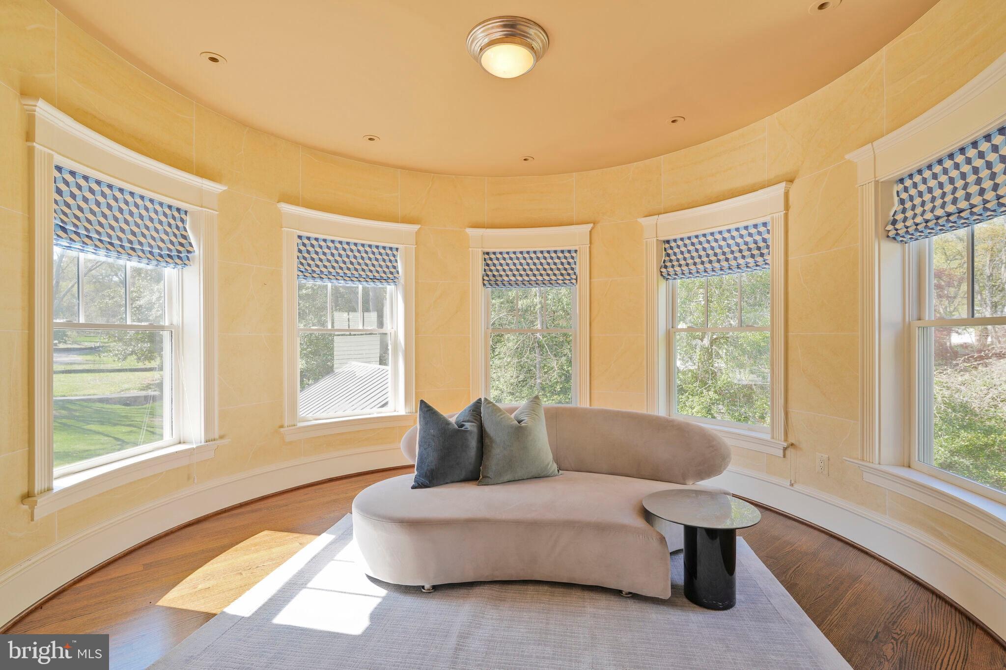 833 Herbert Springs Road Alexandria, VA 22308 - Photo 23 of 34 a living room with furniture and floor to ceiling windows