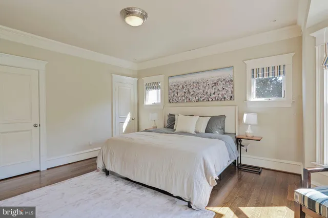 a bedroom with a bed and a night stand