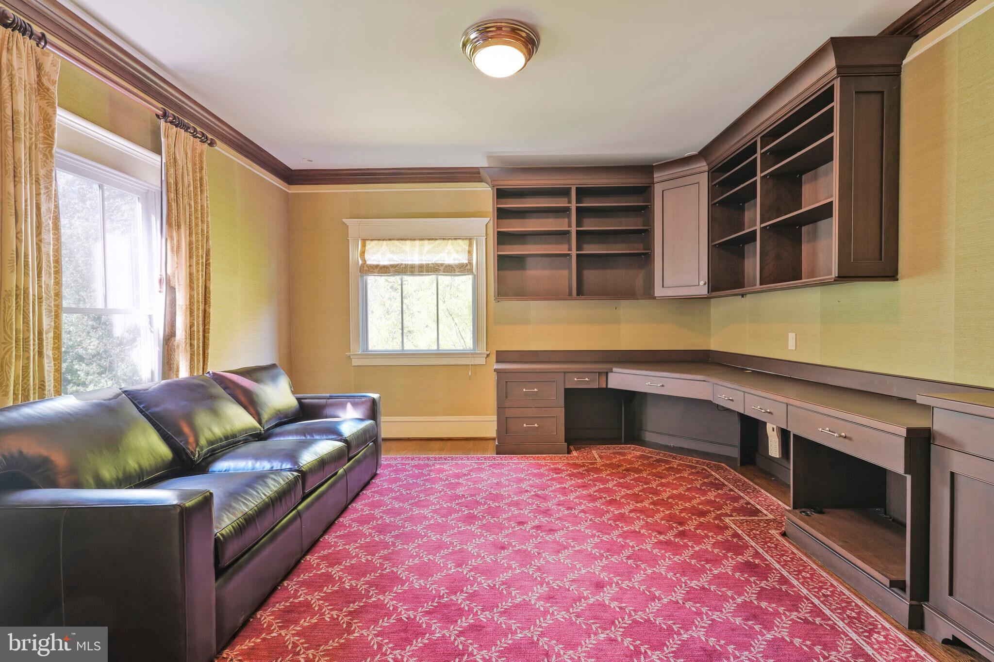 833 Herbert Springs Road Alexandria, VA 22308 - Photo 27 of 34 a living room with furniture and a fireplace