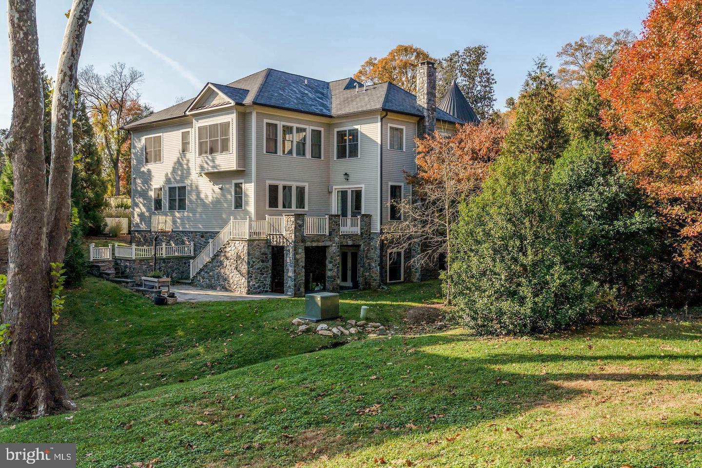 833 Herbert Springs Road Alexandria, VA 22308 - Photo 33 of 34 a view of a house with a big yard and potted plants